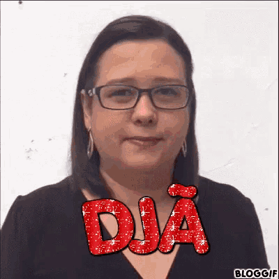 a woman wearing glasses and earrings has the word dja written in red