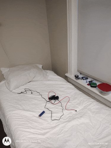 a bed with a motorola logo on the bottom left