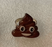 a ring with a poop emoji on it