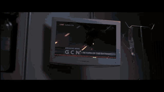a samsung tv shows a breaking news report about the return of the batman