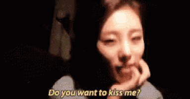 a woman says do you want to kiss me in a dark room
