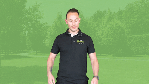 a man wearing a black shirt that says ' chef ' on it stands in front of a green background