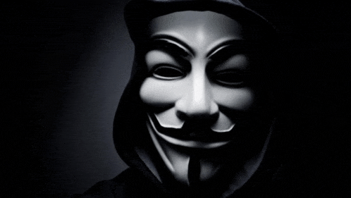 a man wearing a hooded jacket and a white mask with a mustache .