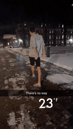 a picture of a person walking in the snow with 23 degrees written on the bottom