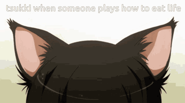 a picture of a cat 's ears with the words " tsuki when someone plays how to eat life "