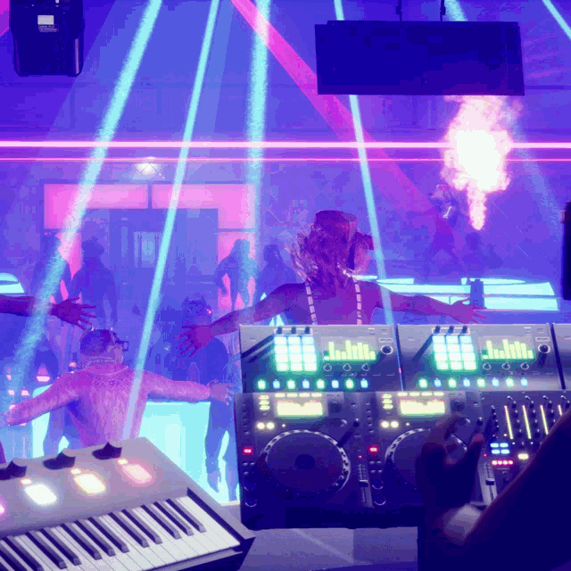 a dj is playing music in a dark room with a keyboard in the foreground