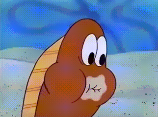 a close up of a cartoon character 's face with a k on it 's mouth .