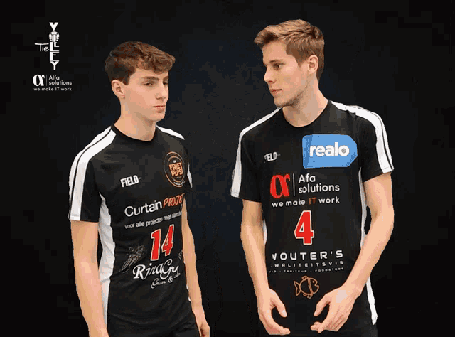 two boys wearing black shirts with realo written on them