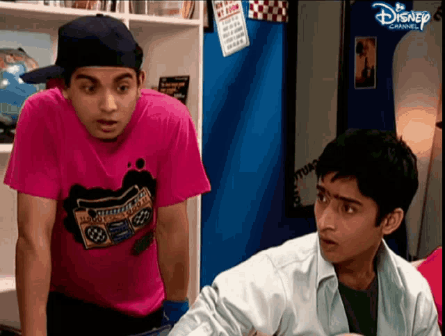 two boys are standing next to each other on a disney channel show