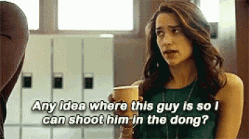 a woman is holding a cup of coffee and saying `` any idea where this guy is so i can shoot him in the dong '' .