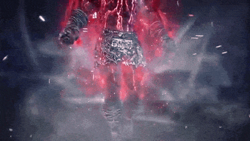 a person is standing in a dark room with red lightning coming from behind them