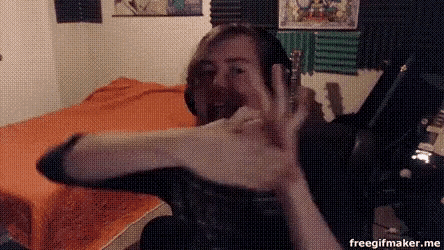 a man is sitting on a bed with his hands up in front of his face and the words freegifmaker.me is on the bottom right