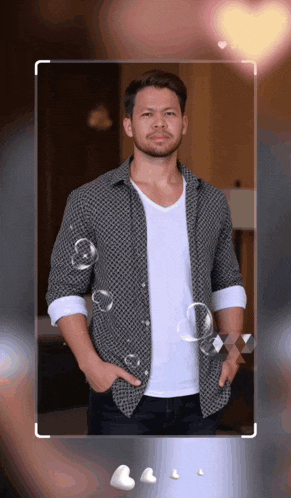 a man with his hands in his pockets is surrounded by bubbles