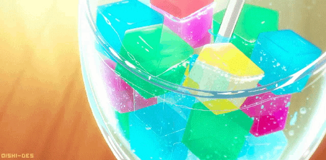 a bowl of colorful ice cubes with a straw in it and the words ishi-des below it
