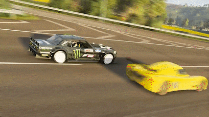 a monster energy car is driving next to a yellow car