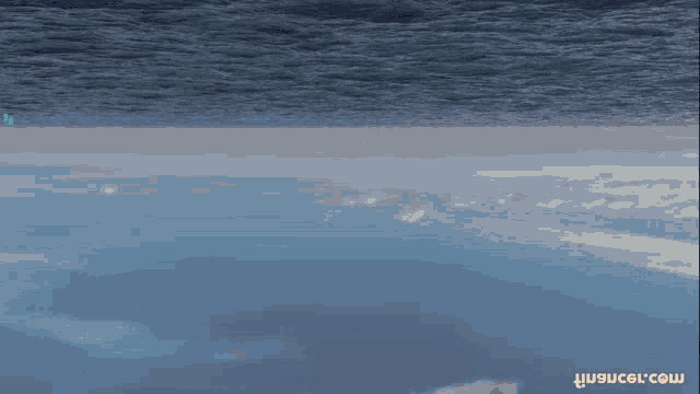 a coin with a purple and blue stripe is floating in the air