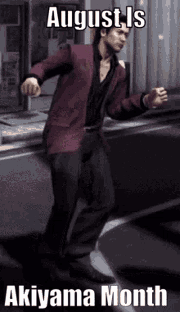 a man in a red jacket is dancing in front of a sign that says august is akiyama month .