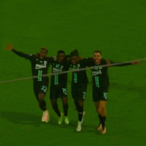 a group of soccer players wearing william 's jerseys