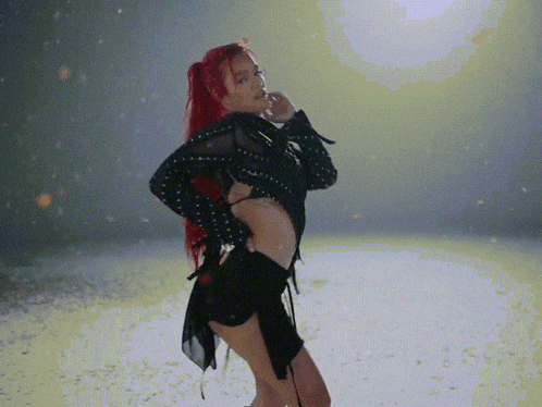 a woman with red hair in a black dress