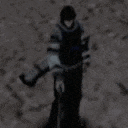 a blurry image of a person holding a gun