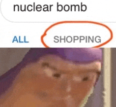 a close up of buzz lightyear 's face with the words `` nuclear bomb all shopping '' written on it .