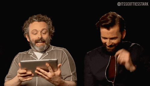 a man with a beard is holding a tablet and says david what has happen to your hair