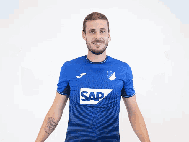 a man in a blue shirt with the word sap on the front