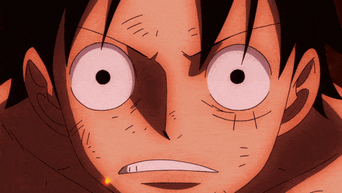 a close up of a cartoon character 's face with big pink eyes