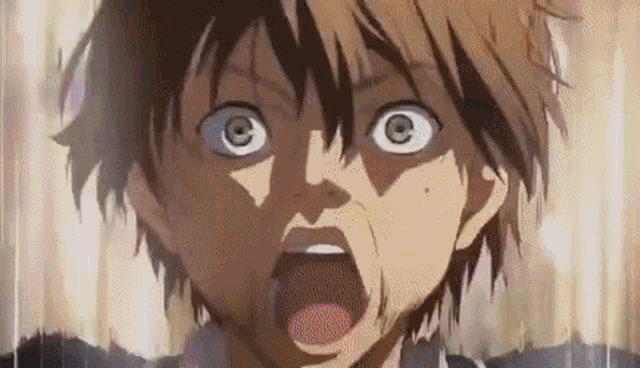 a close up of a person 's face with their mouth open and a surprised look on their face .