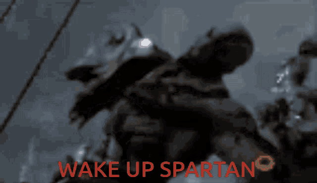 a blurred image with the words wake up spartan written in red