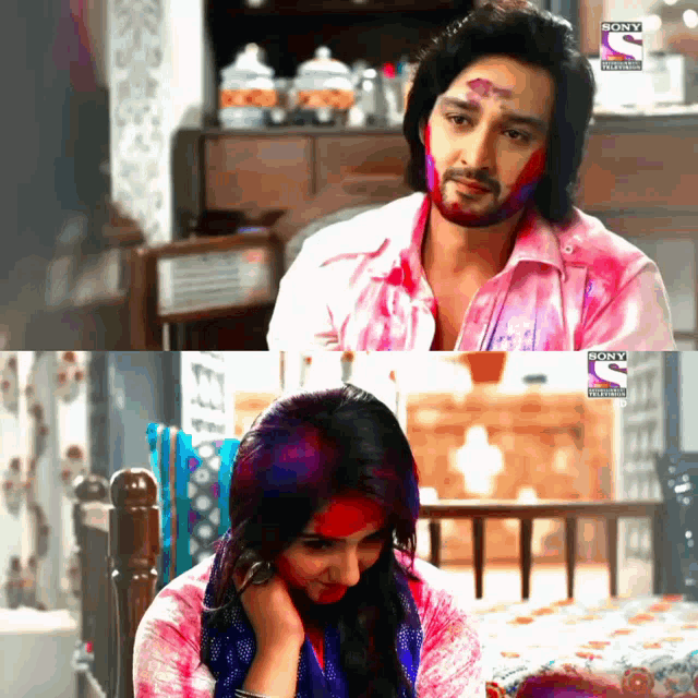 a man with holi paint on his face and a woman with holi paint on their face