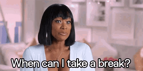 a woman is sitting on a couch and asking when can i take a break ?