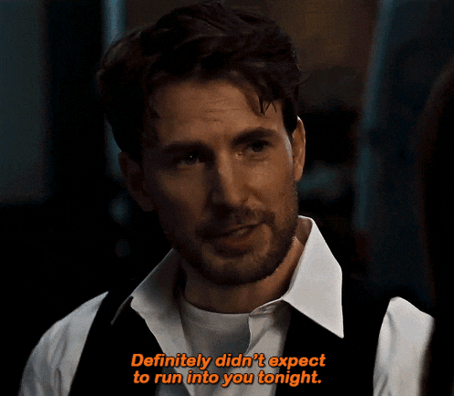 a man in a white shirt and black vest says " definitely didn 't expect to run into you tonight "