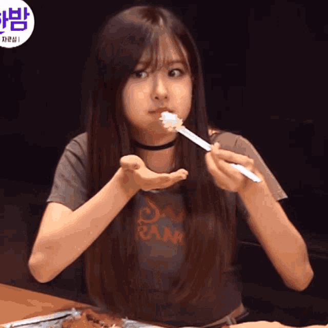 a girl with long hair wearing a shirt that says rank
