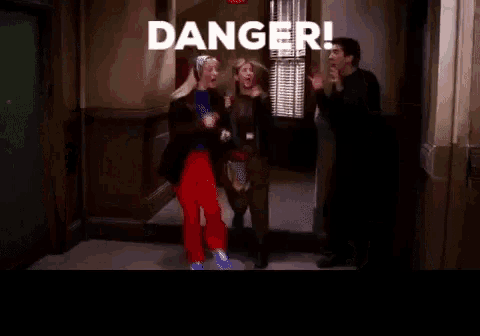 a group of people standing in a hallway with the words danger written on the bottom