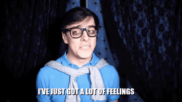 a man with glasses and a sweater around his neck says i 've just got a lot of feelings