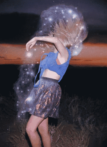 a woman in a blue top and a skirt is dancing