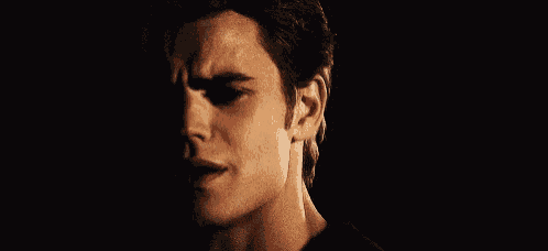 a close up of a man 's face with his eyes closed .