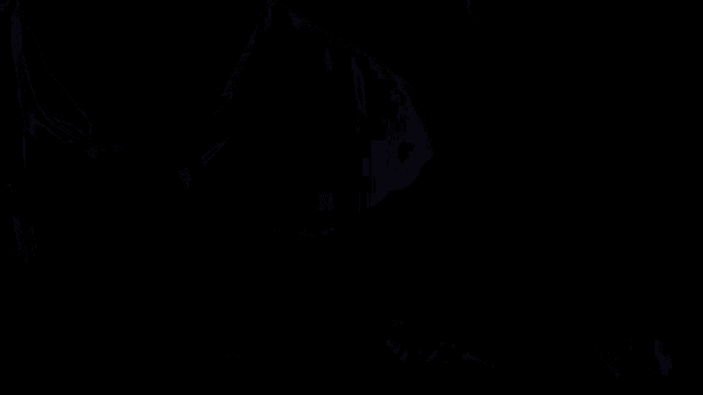 a close up of a man 's face with a light behind him