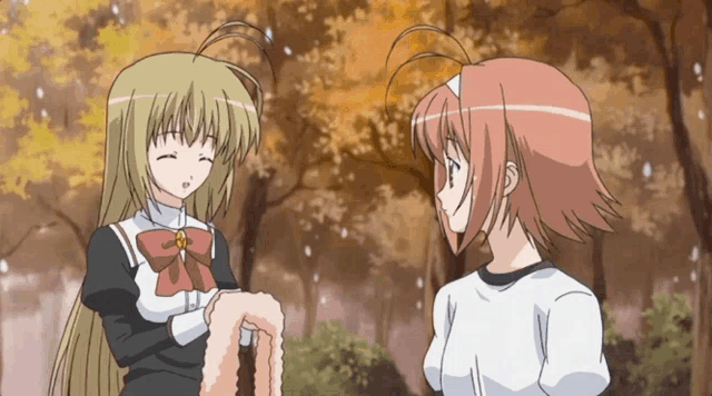two anime girls are standing next to each other in a park