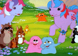 a bunch of ponies and animals are standing in a grassy field