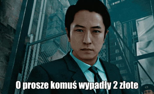 a man in a suit and tie with the words o prosze komus wypady 2 złote below him
