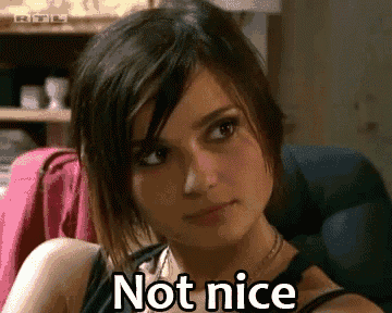 a woman is sitting in a chair with the words not nice written on her face