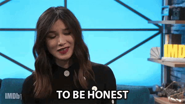 a woman sitting on a couch with the words to be honest on her face