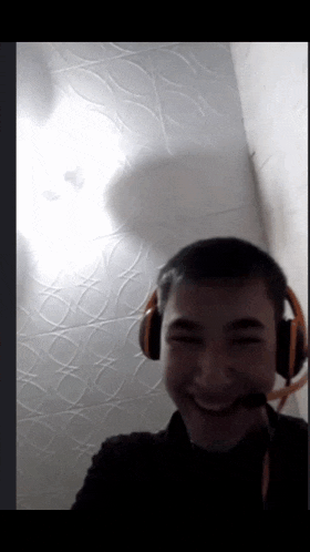 a young boy wearing headphones and a microphone