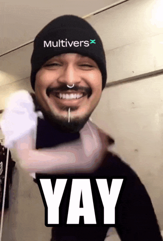 a man wearing a beanie that says " multivers " on it