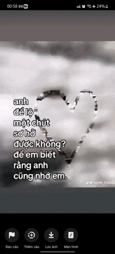 a black and white photo of a heart in the clouds with a quote in a foreign language