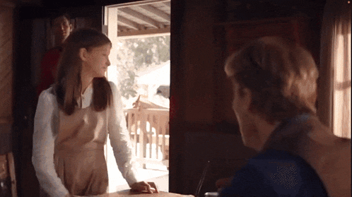 a man and a girl are standing next to each other