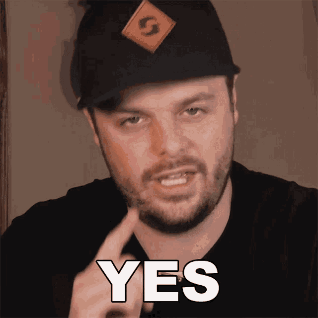 a man wearing a black hat and a black shirt says yes