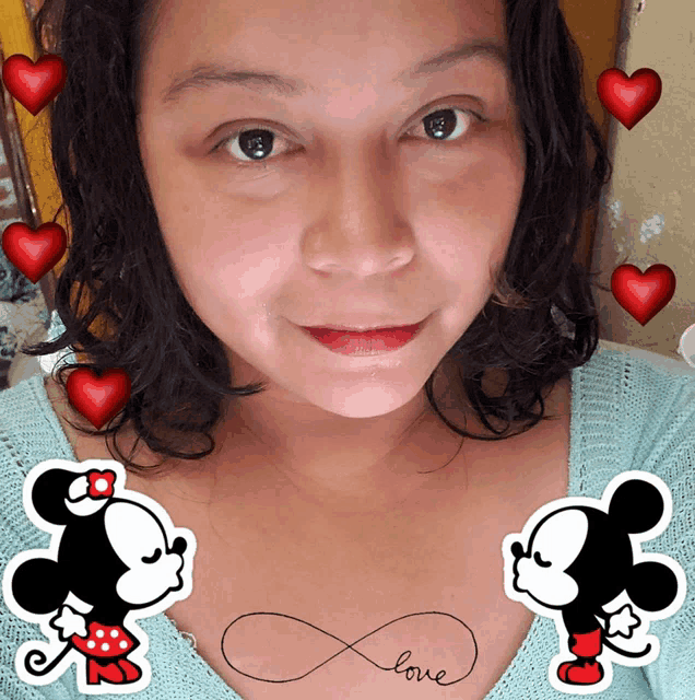 a woman with two mickey mouse stickers on her chest